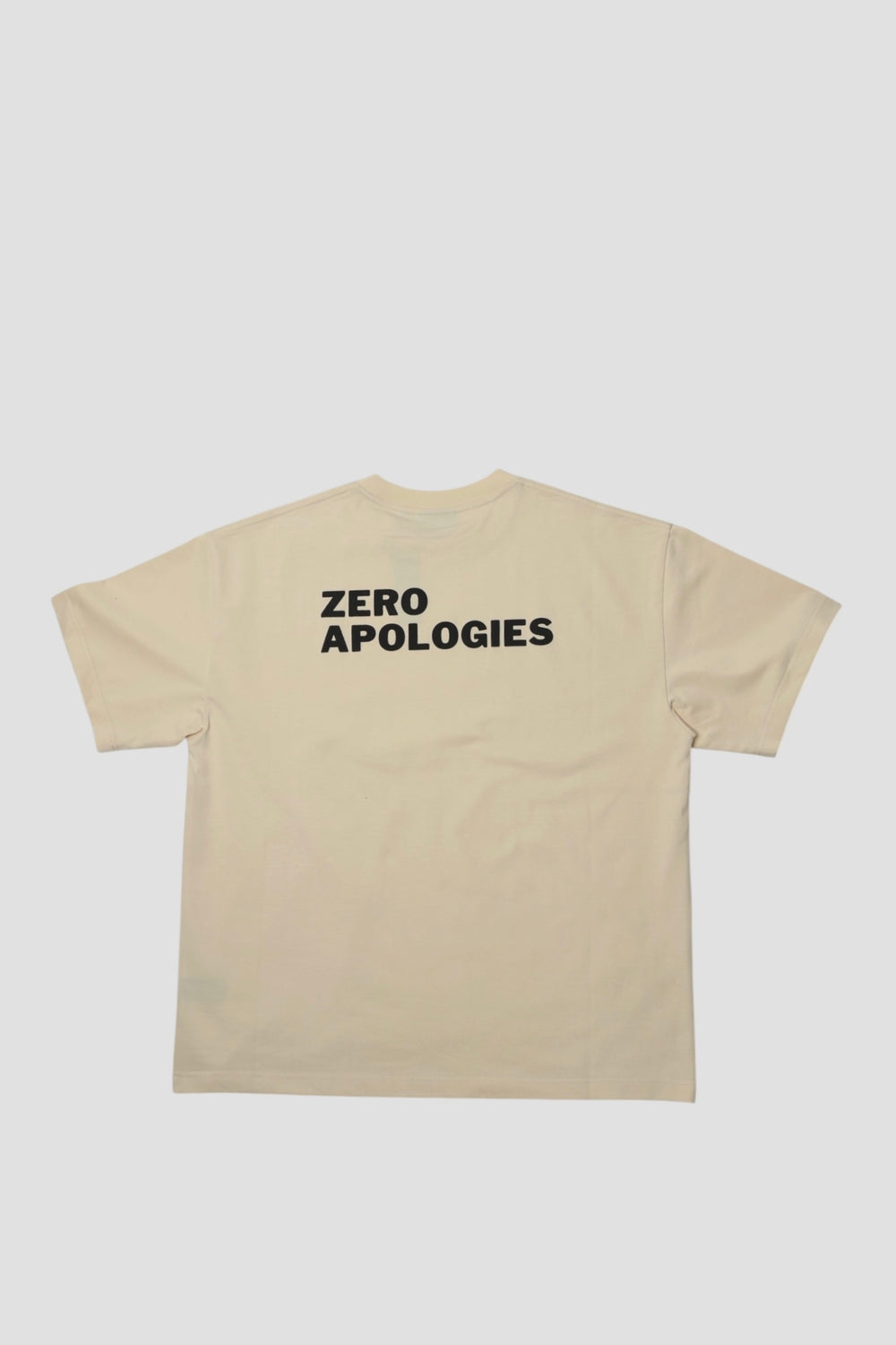 Back of the seedpearl DROP 001 tee with ZERO APOLOGIES in raised puff print