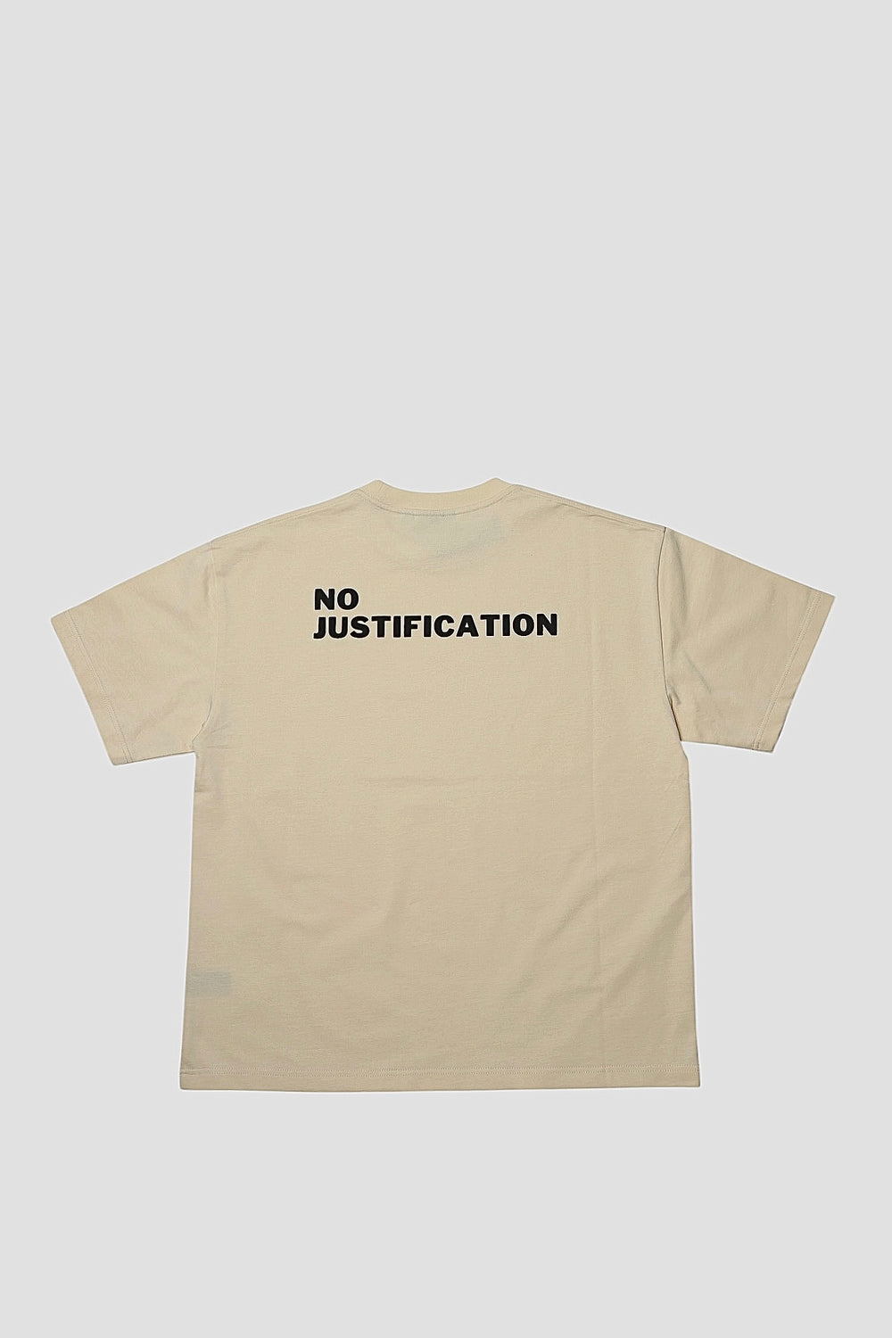 Back of the seedpearl DROP 001 tee with NO JUSTIFICATION in raised puff print