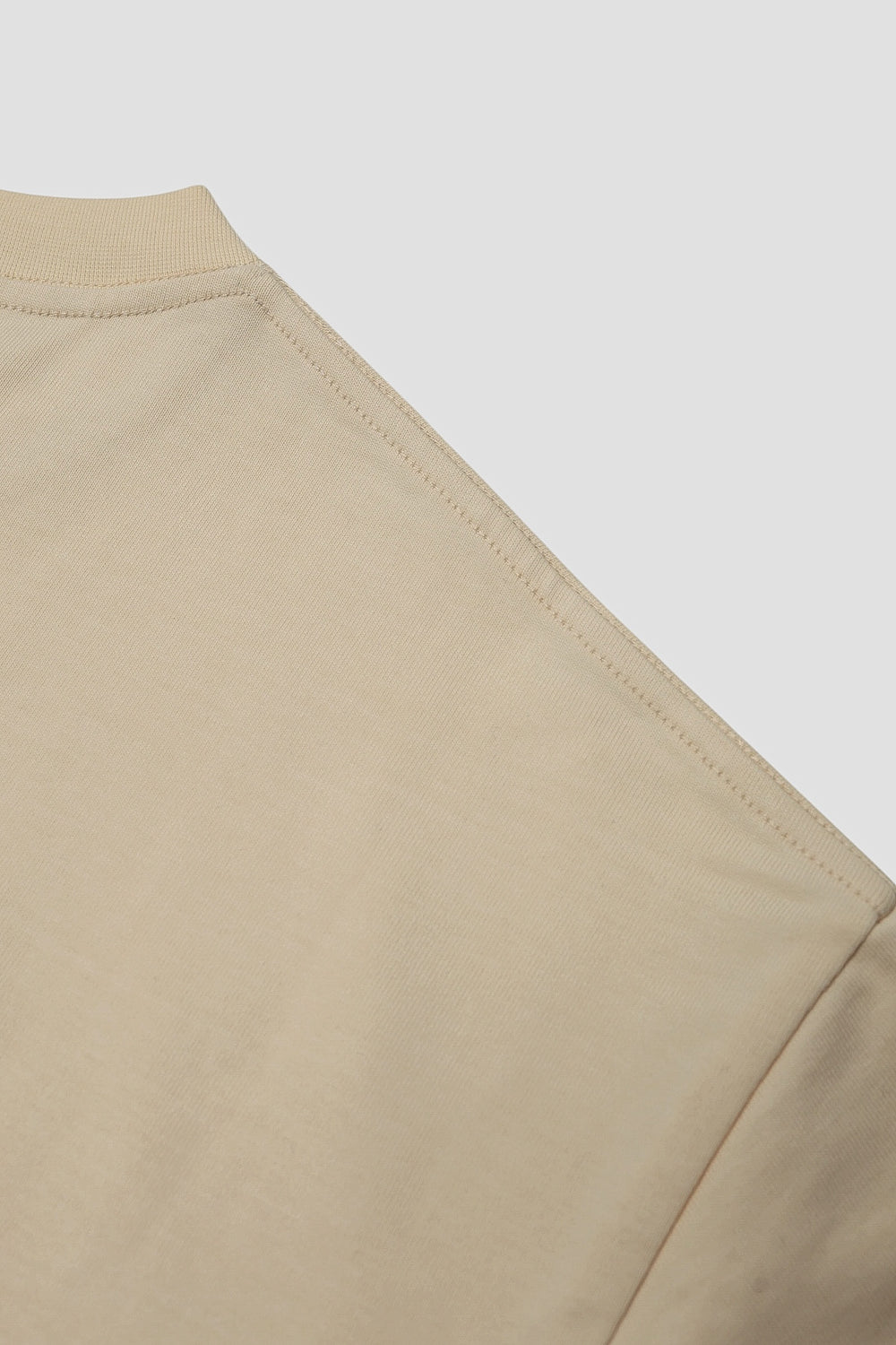Sleeve and shoulder seam detail on the seedpearl DROP 001 tee