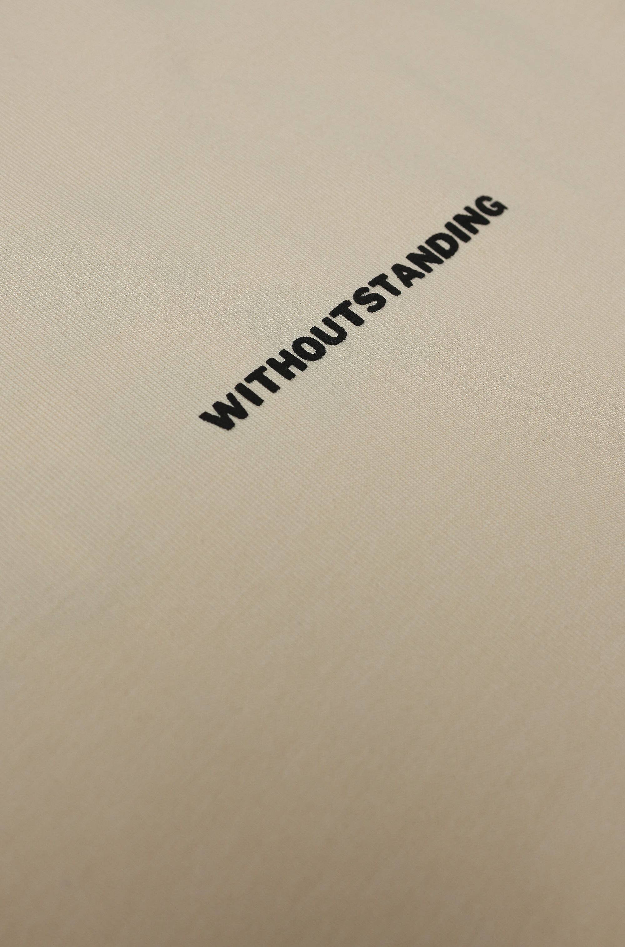 WITHOUTSTANDING mark on heavyweight cotton fabric