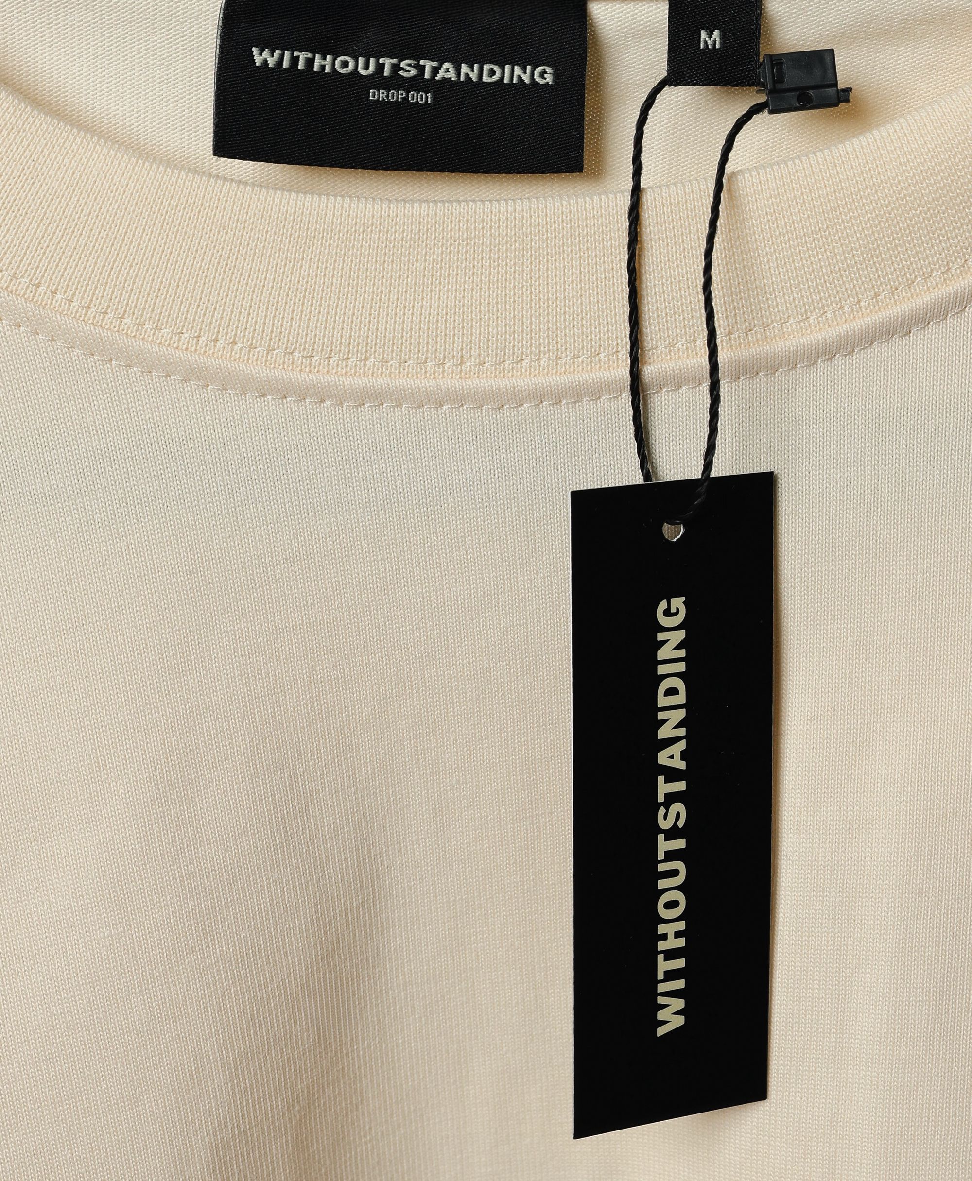 WITHOUTSTANDING hang tag on the garment