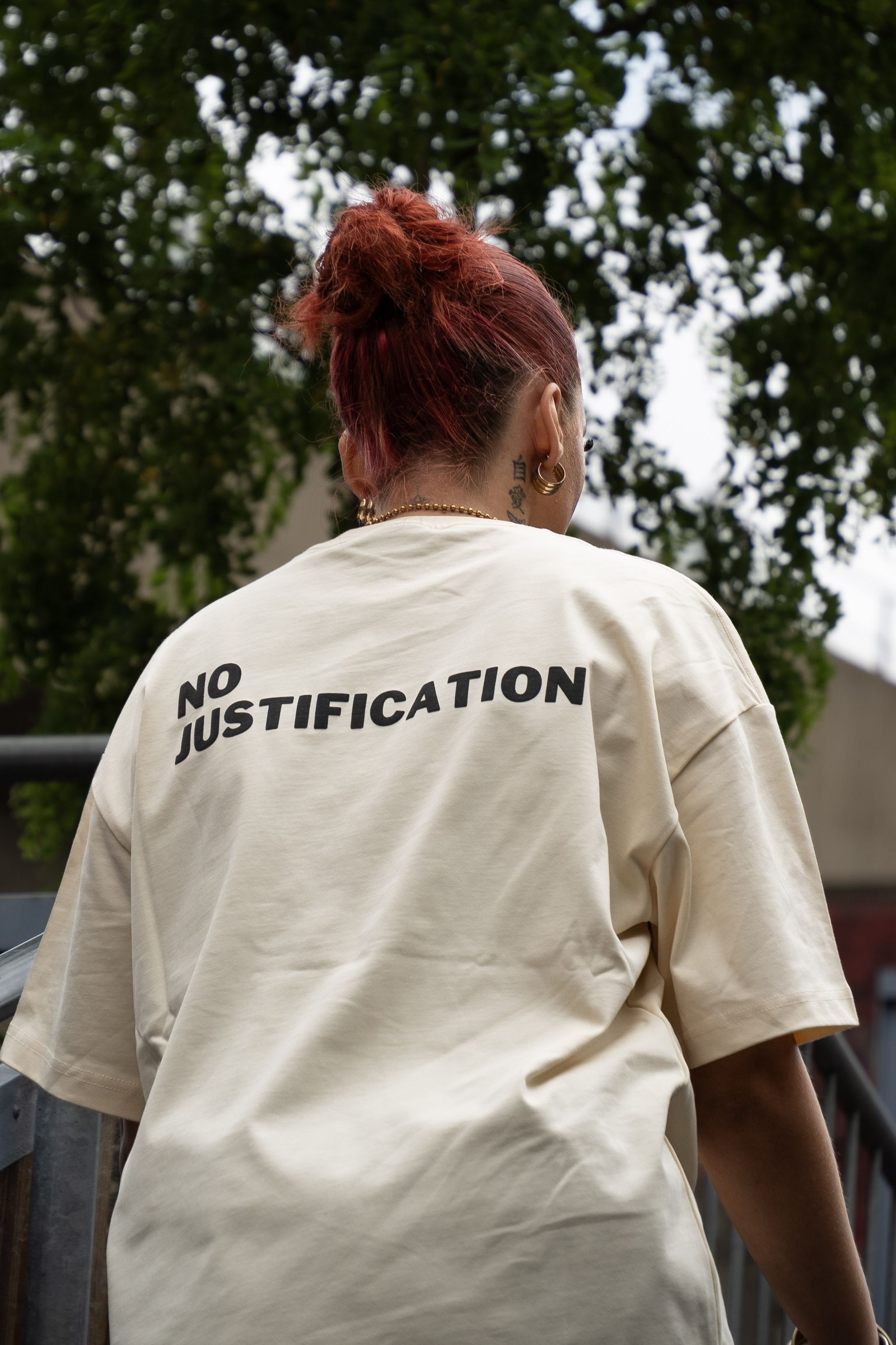 NO JUSTIFICATION worn in London, seen from behind