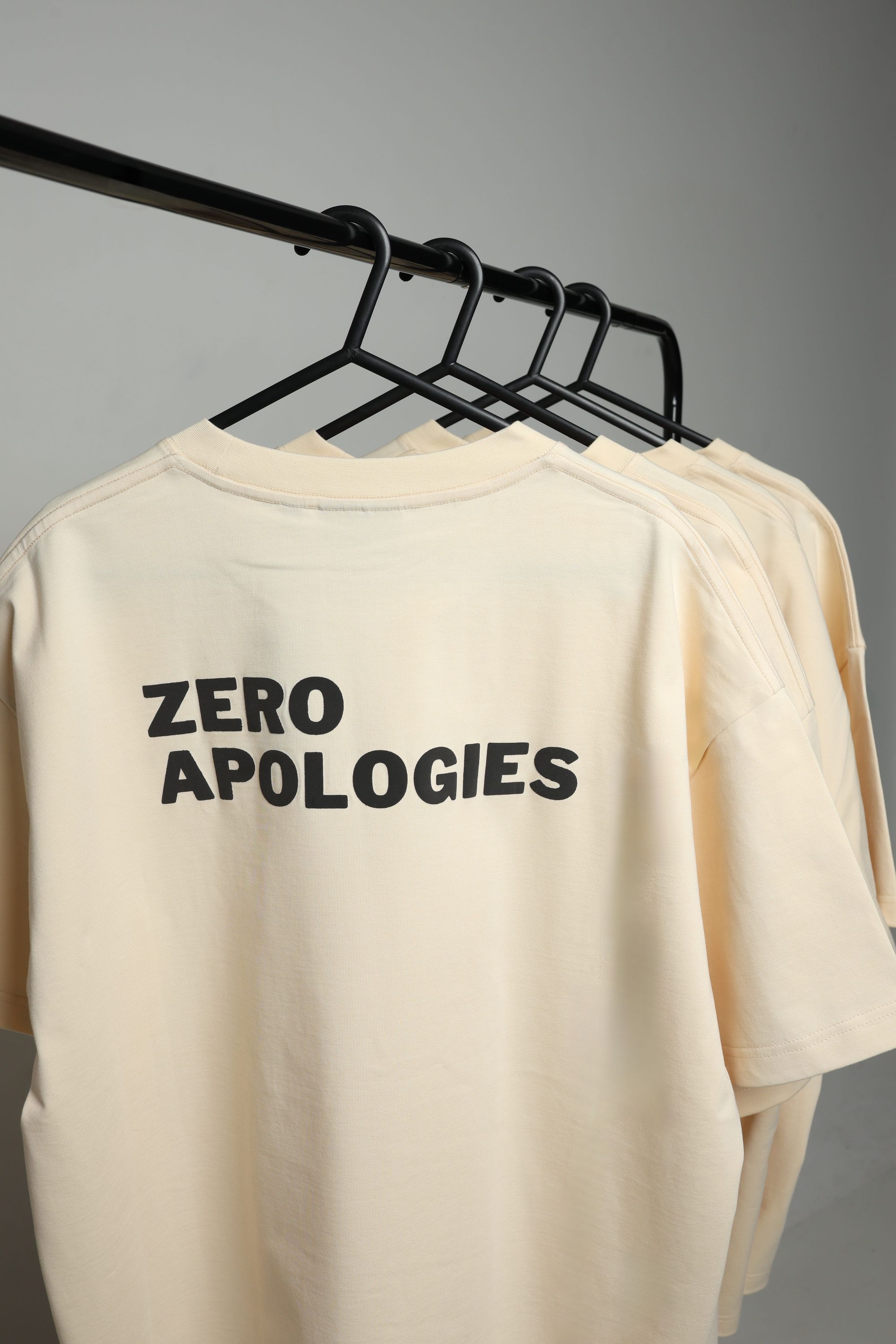 ZERO APOLOGIES on the rail in the studio, the raised print in full